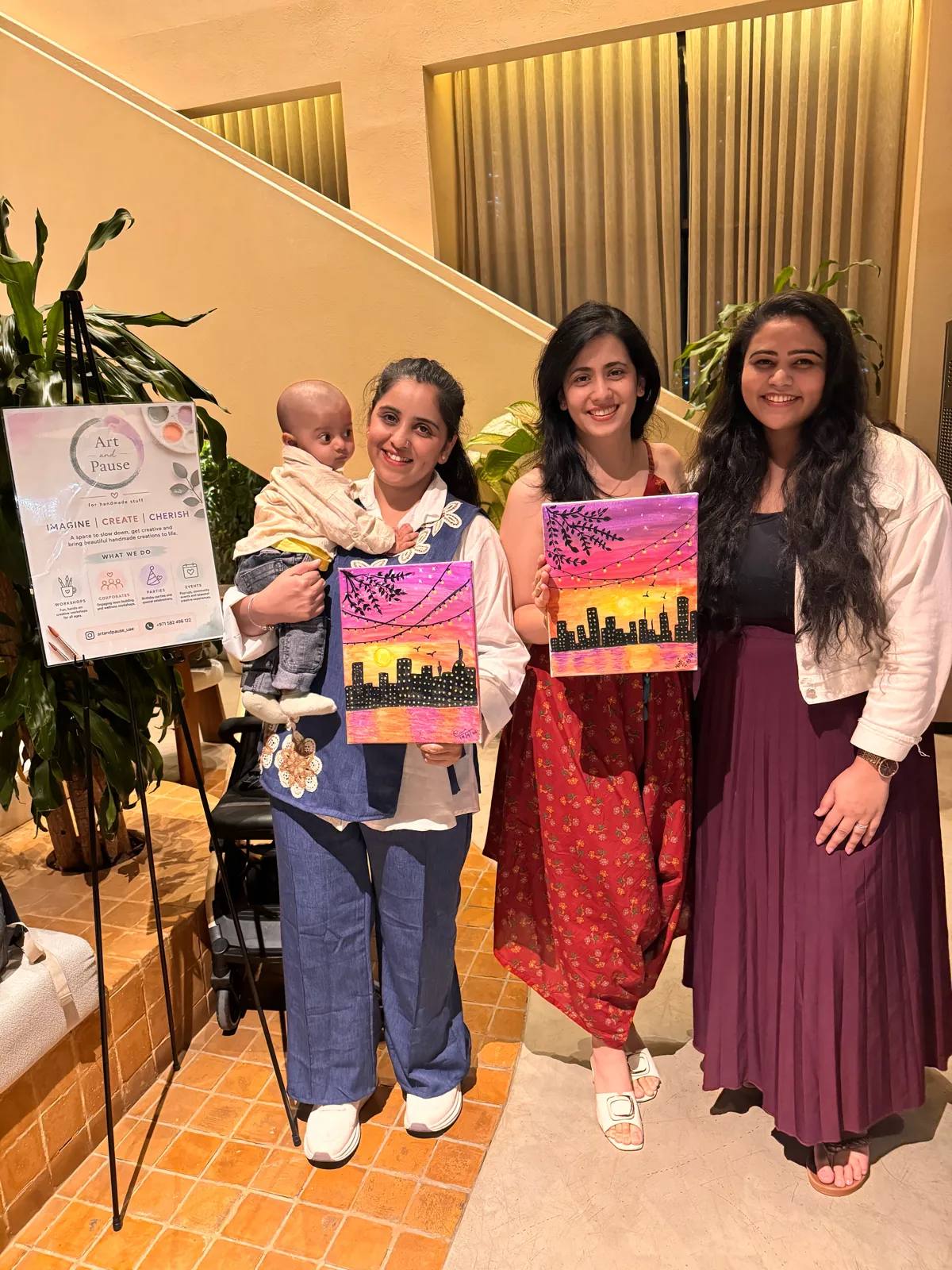 Guests painting at an Art & Pause workshop