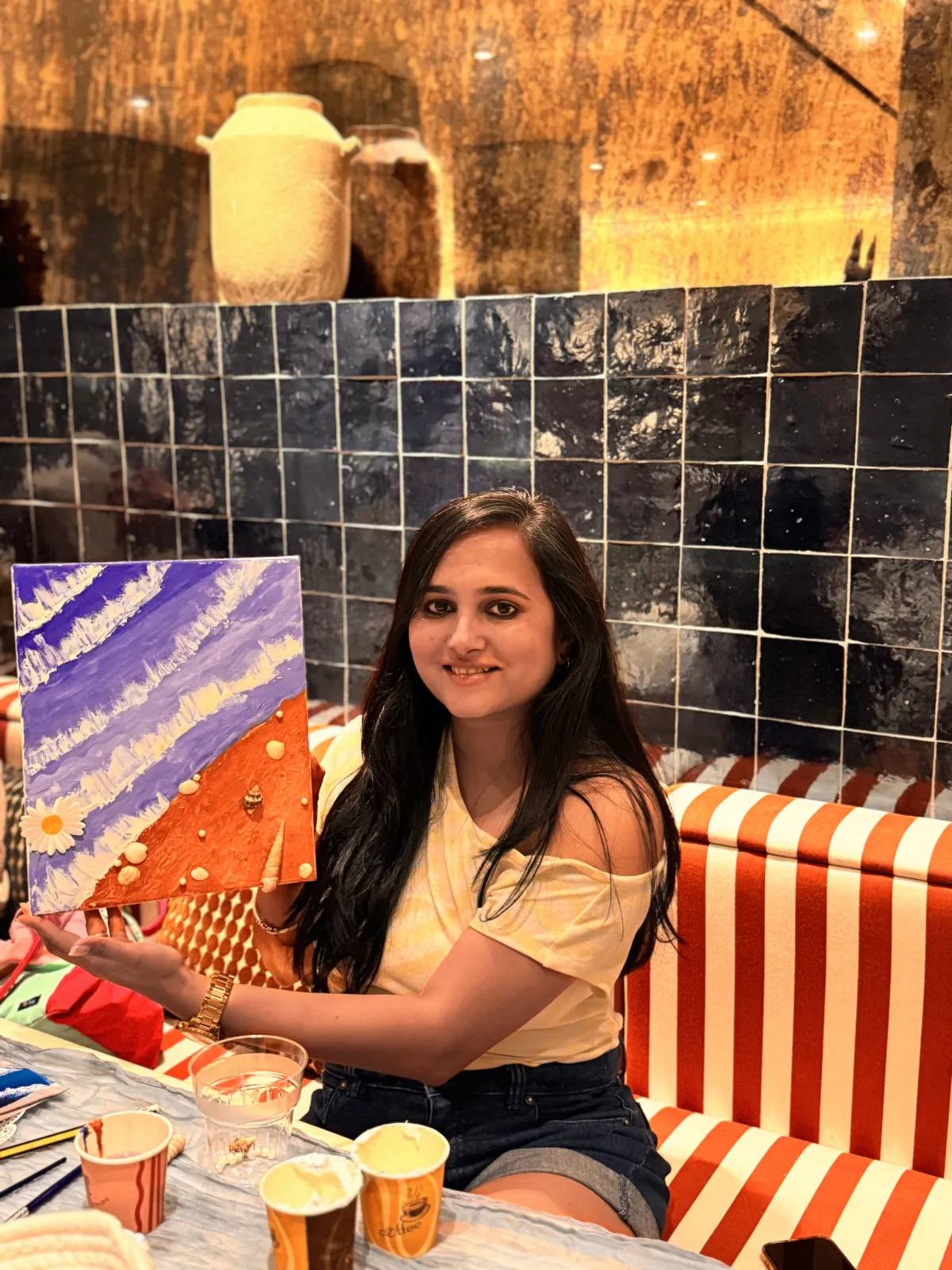 Guests painting at an Art & Pause workshop
