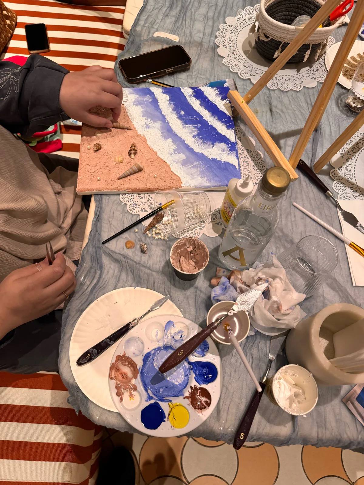 Guests painting at an Art & Pause workshop