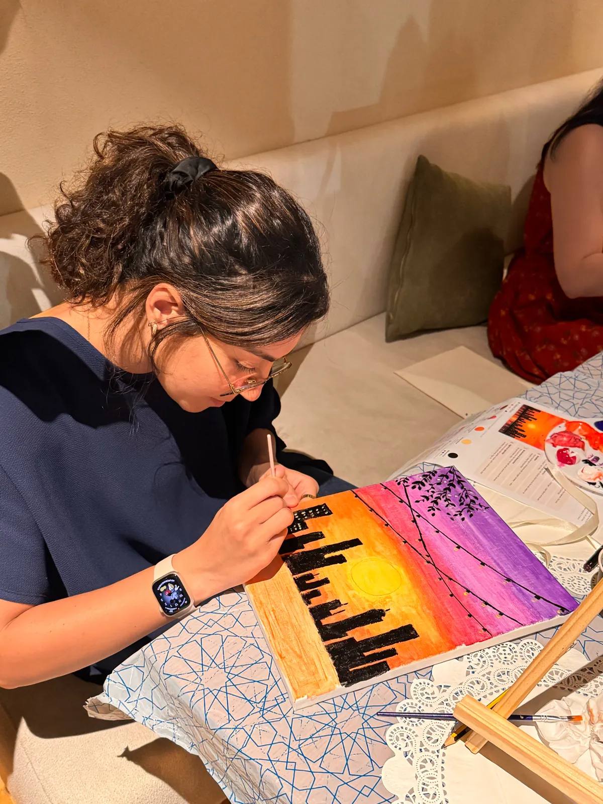 Guests painting at an Art & Pause workshop
