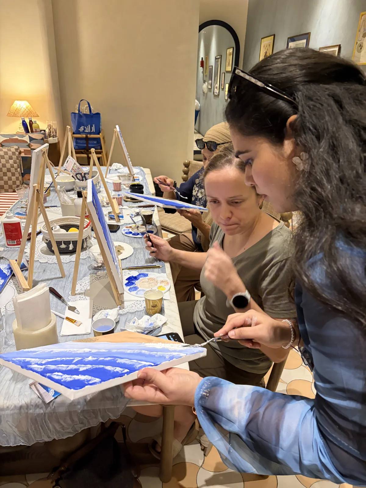 Guests painting at an Art & Pause workshop