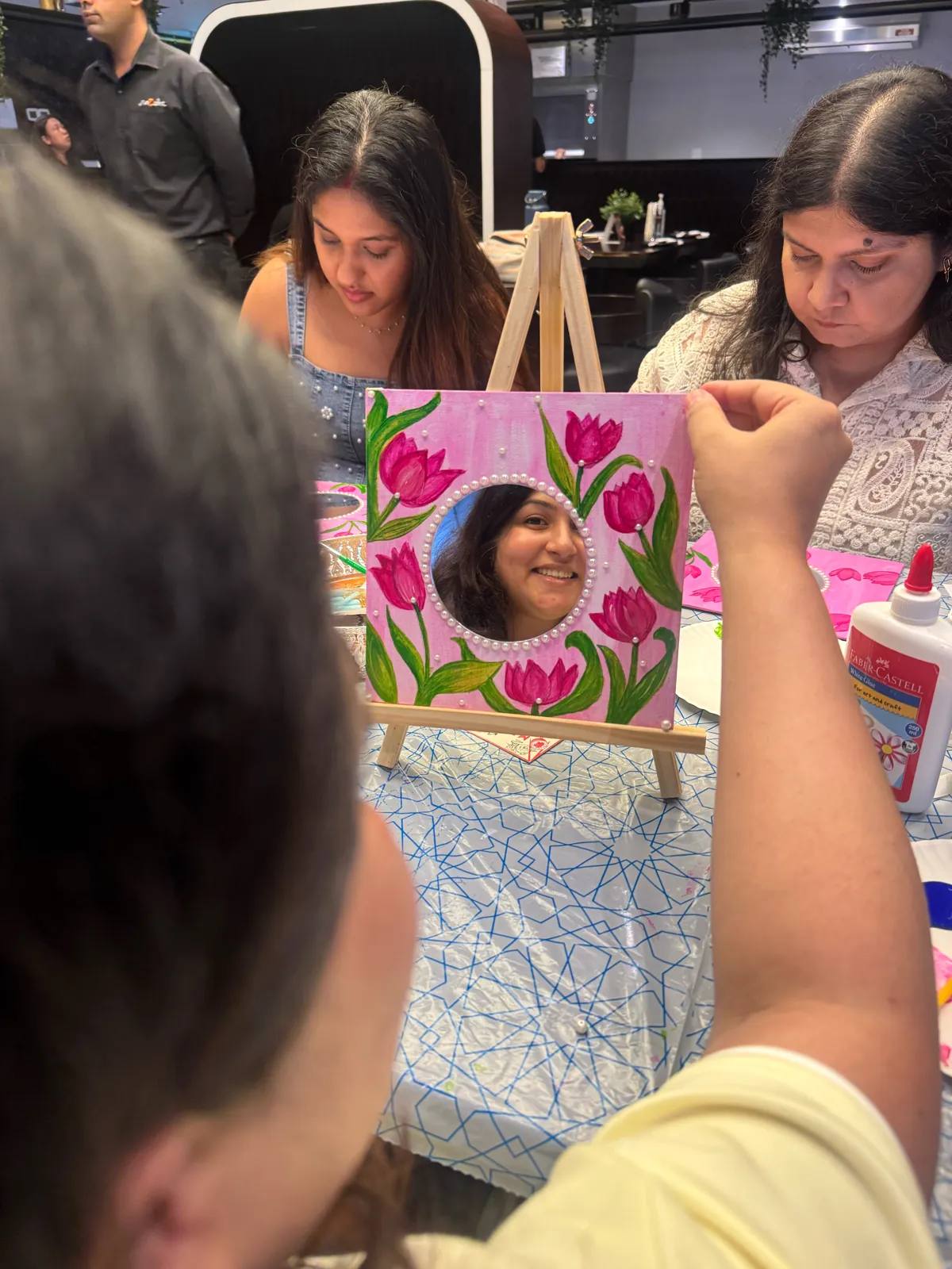 Guests painting at an Art & Pause workshop
