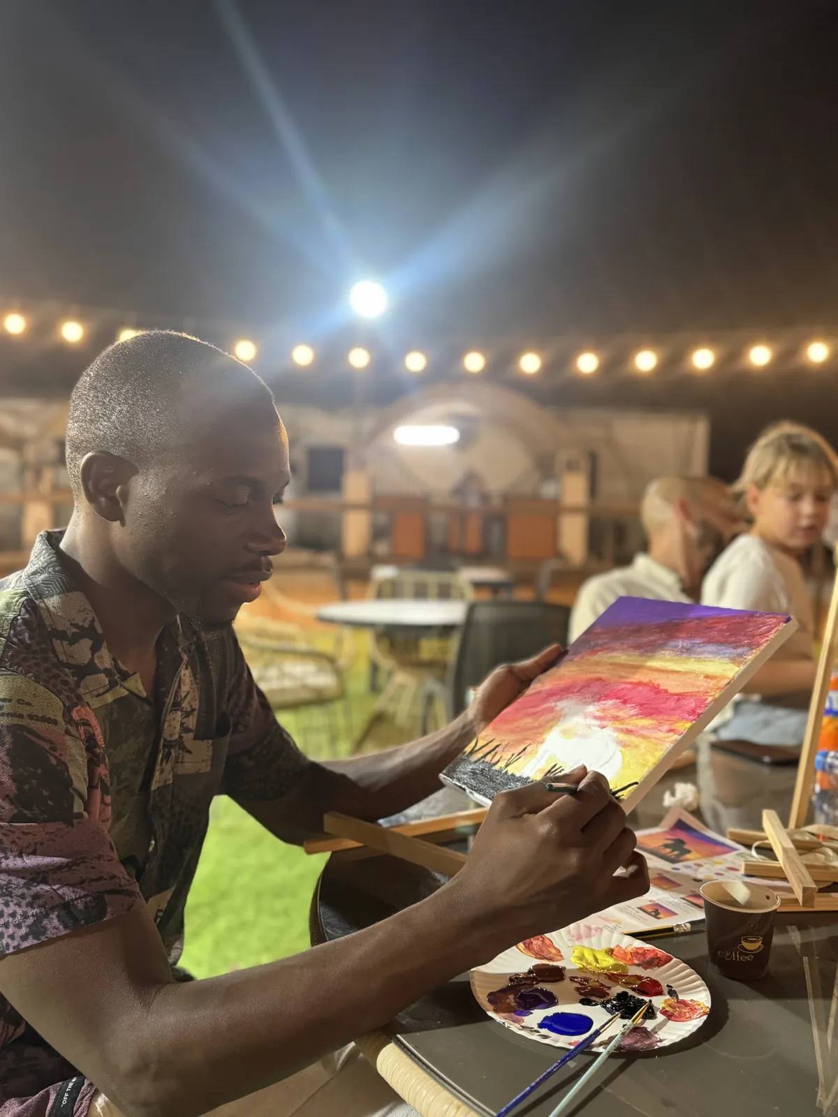 Guests painting at an Art & Pause workshop, at the horse stable, Al Shahama