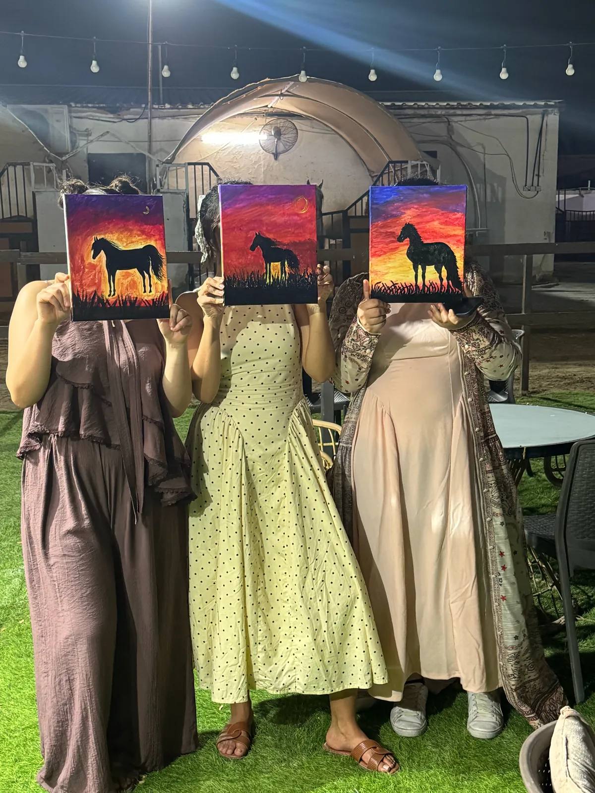 Guests painting at an Art & Pause workshop, at the horse stable, Al Shahama