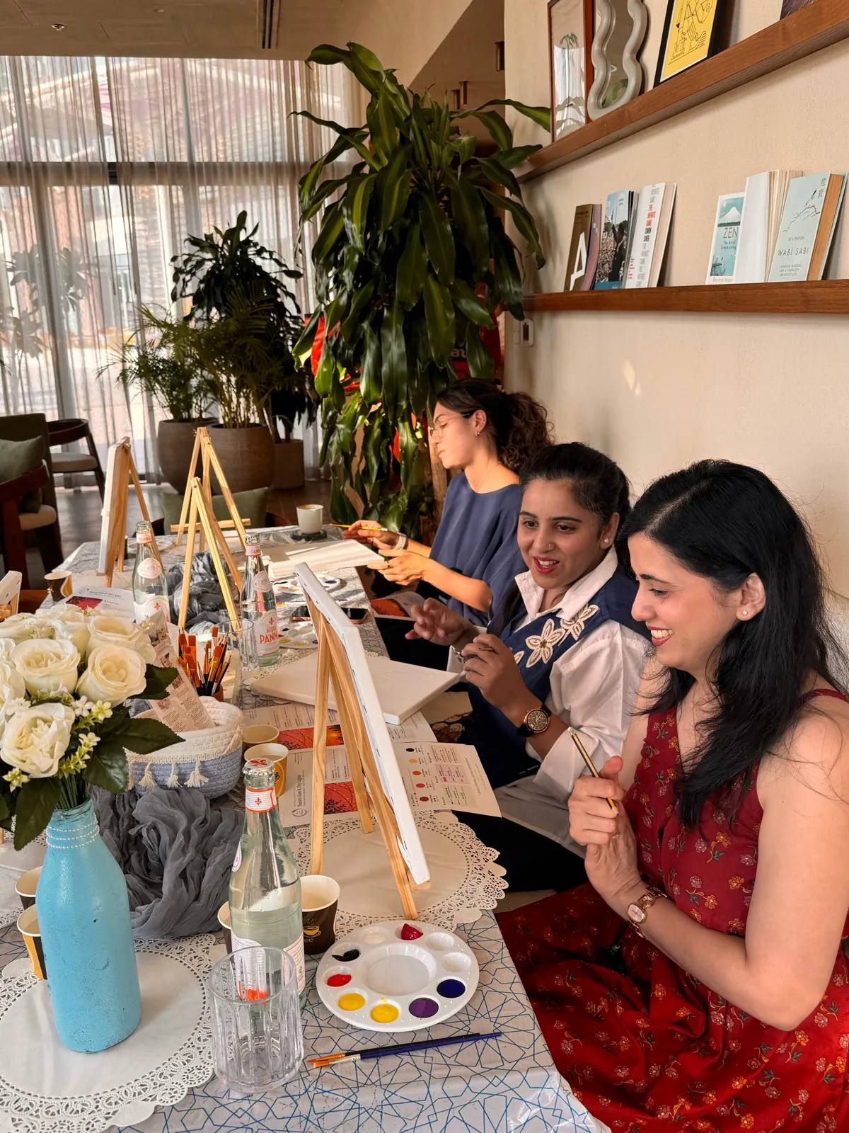 Guests painting at an Art & Pause workshop, at Ritual Cafe