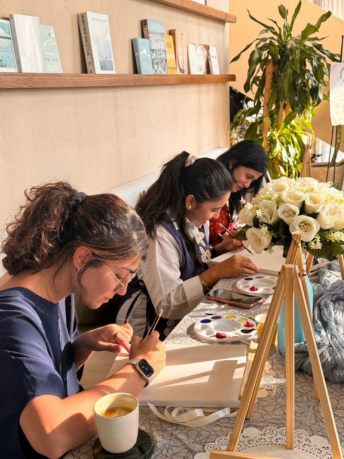 Guests painting at an Art & Pause workshop, at Ritual Cafe