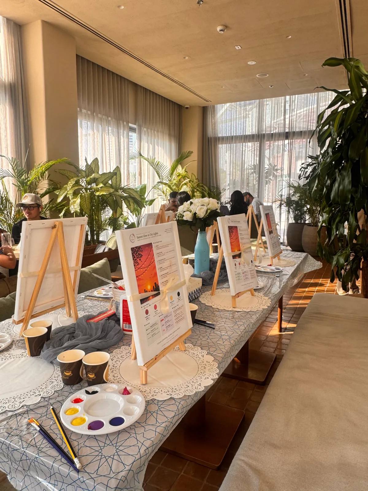 Guests painting at an Art & Pause workshop, at Ritual Cafe