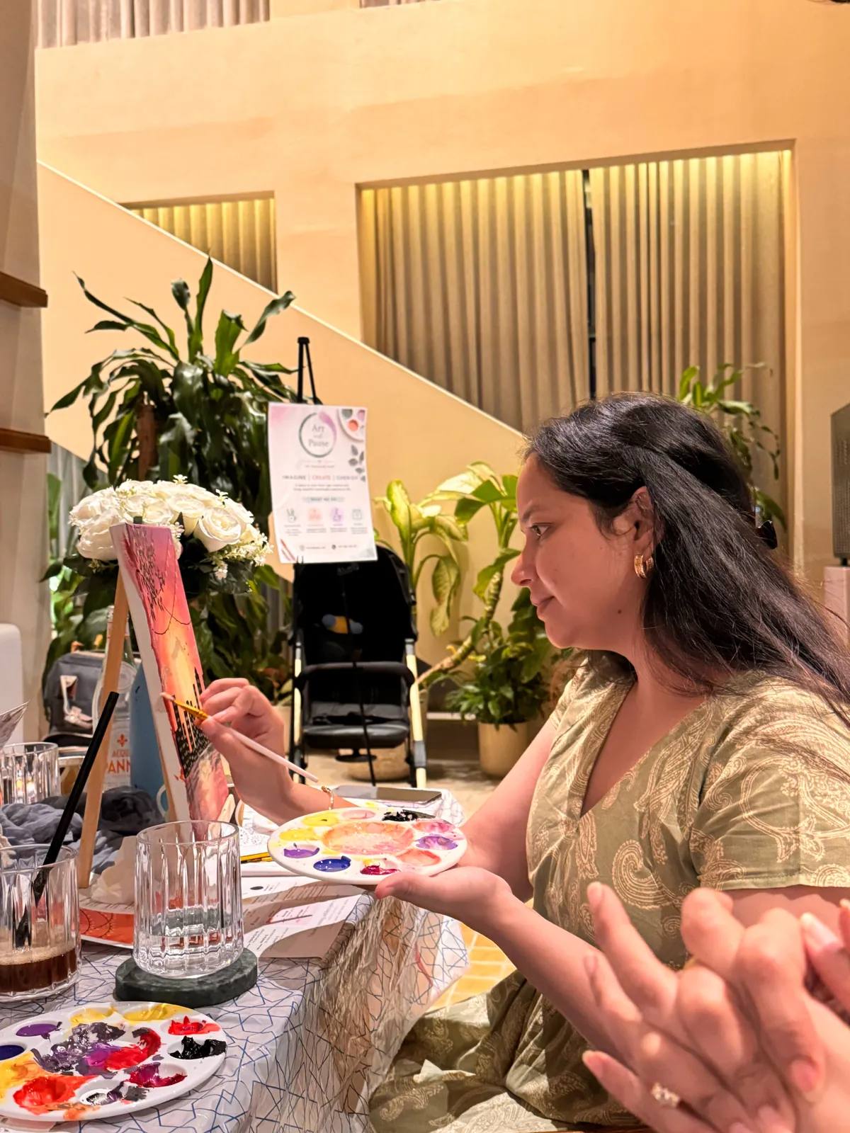 Guests painting at an Art & Pause workshop