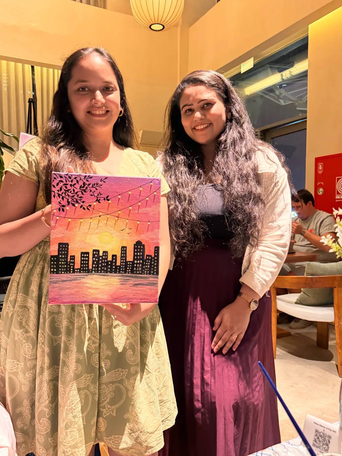 Guests painting at an Art & Pause workshop