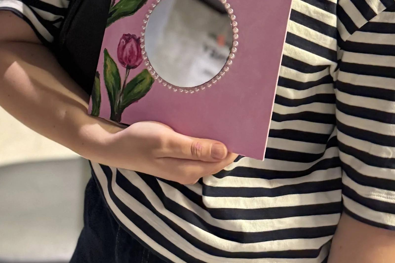 Finished mirror with pearl details, made at a paint and sip workshop in Dubai
